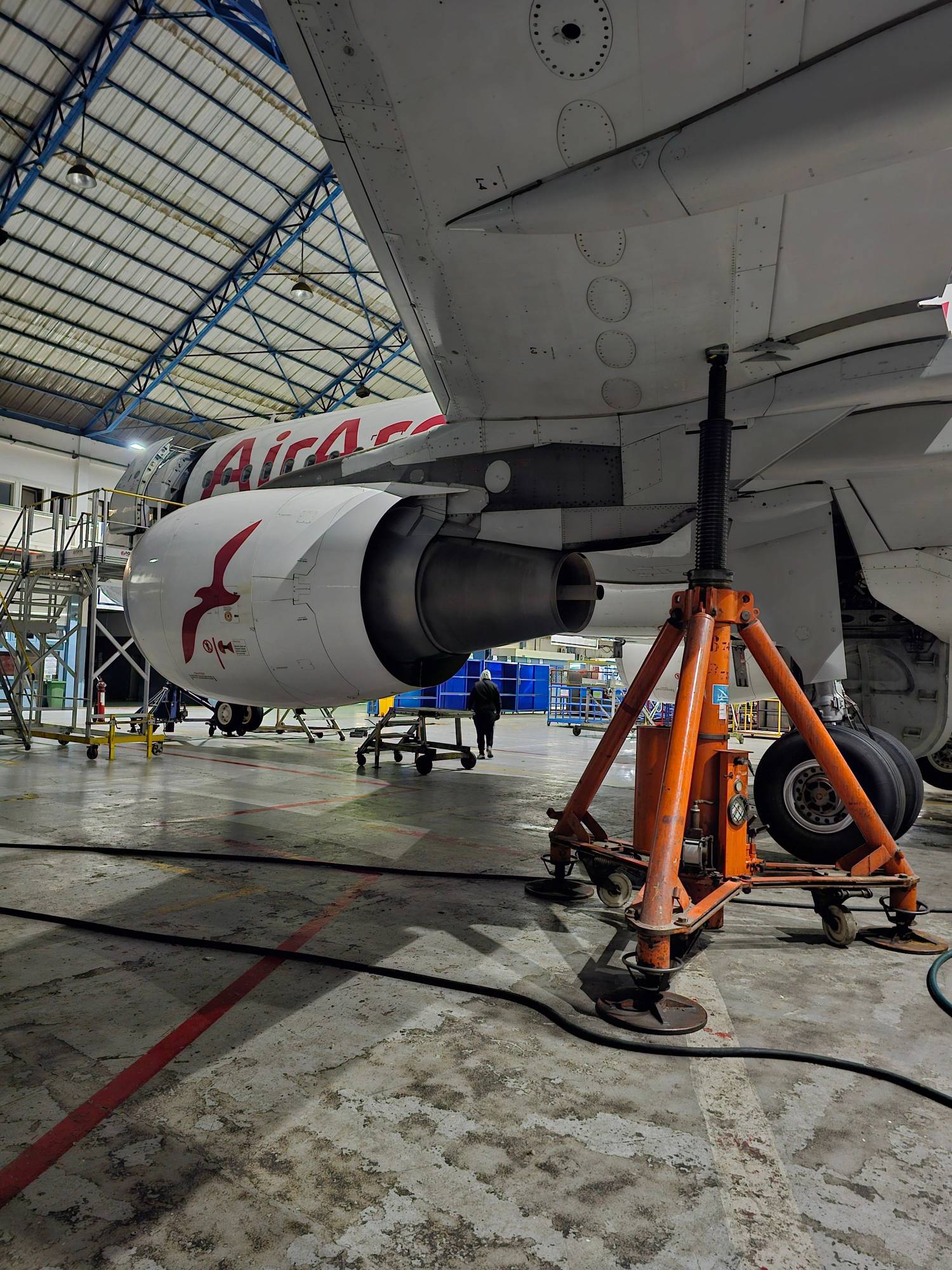 Aircraft maintenance engineer working in a hangar